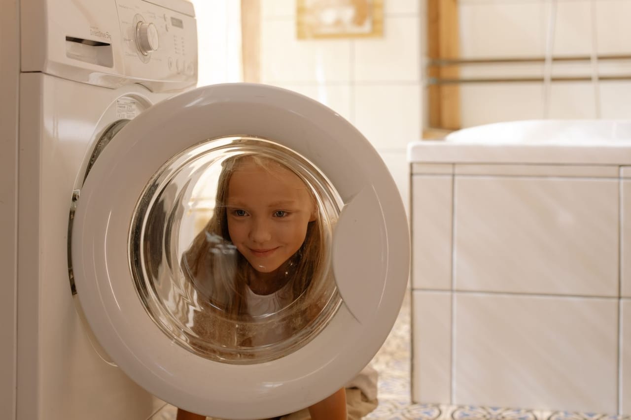 Appliance repair Bullhead City AZ: Girl helping in doing the laundry