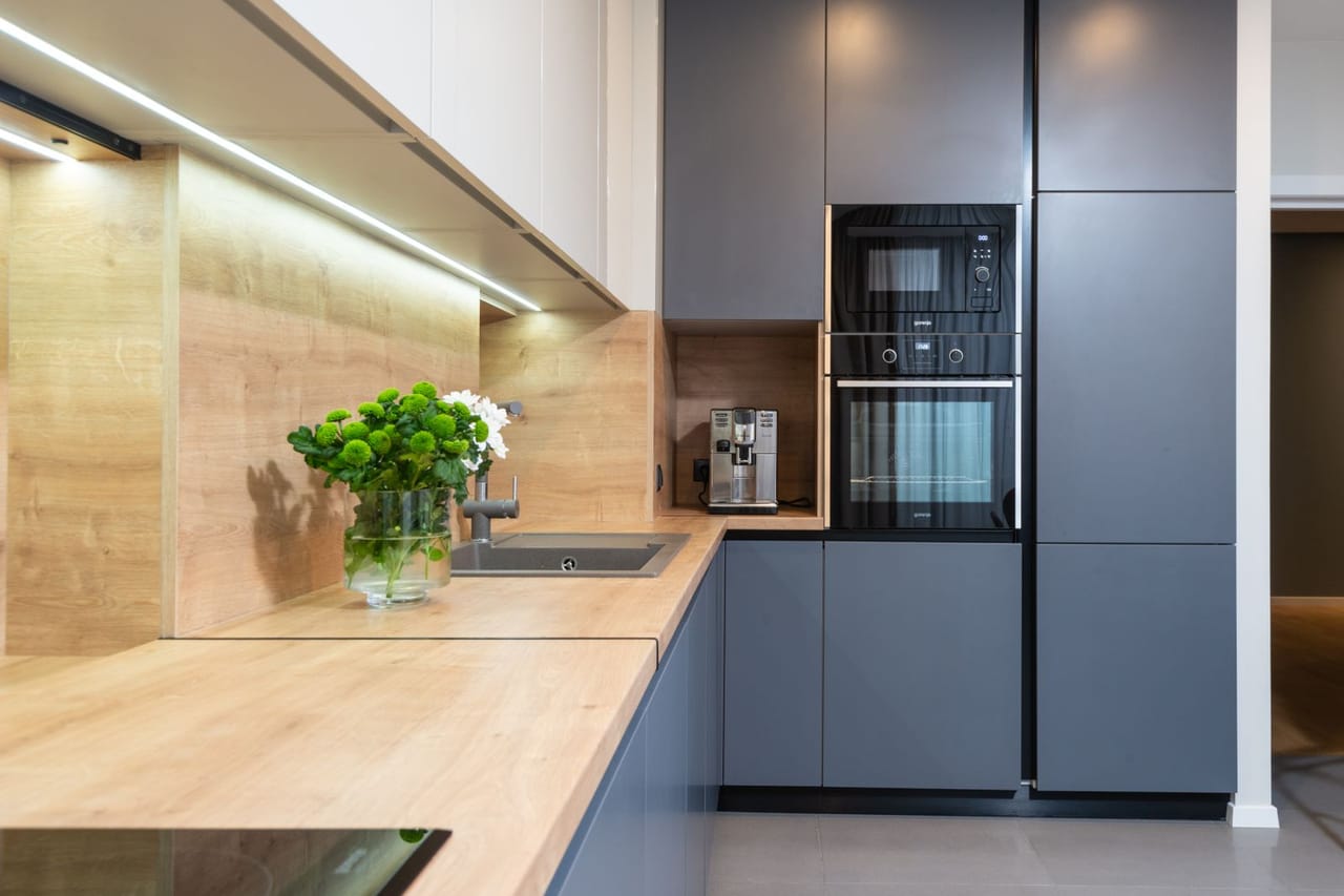 Appliance repair Crawfordsville IN: Contemporary kitchen interior with furniture and electric appliances