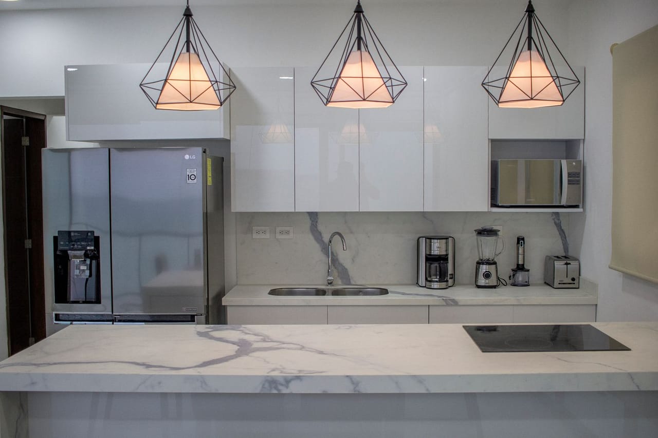 Appliance repair Grand Island NE: Kitchen with an island and marble worktop