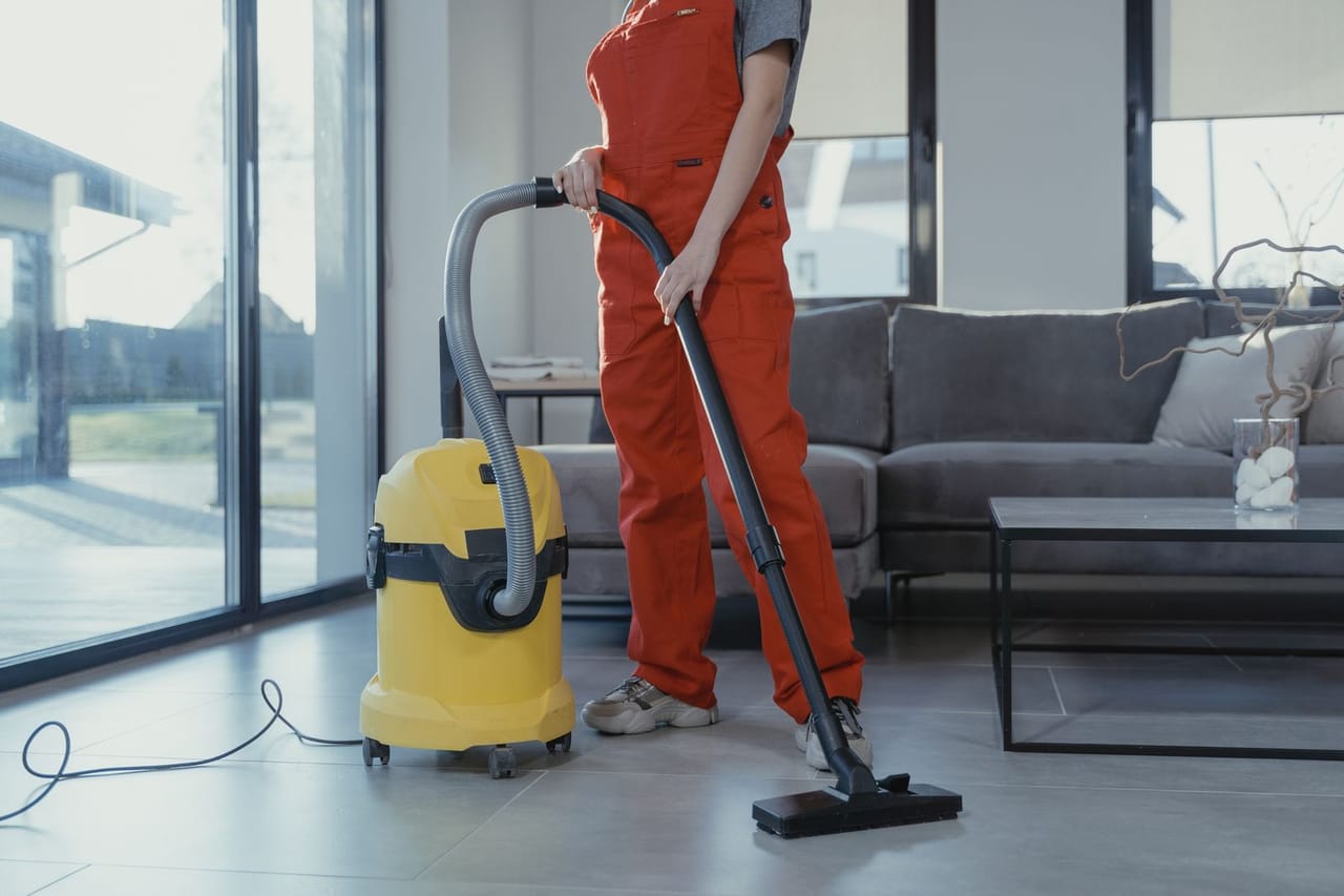 Appliance repair Hamilton OH: Person vacuuming the floor