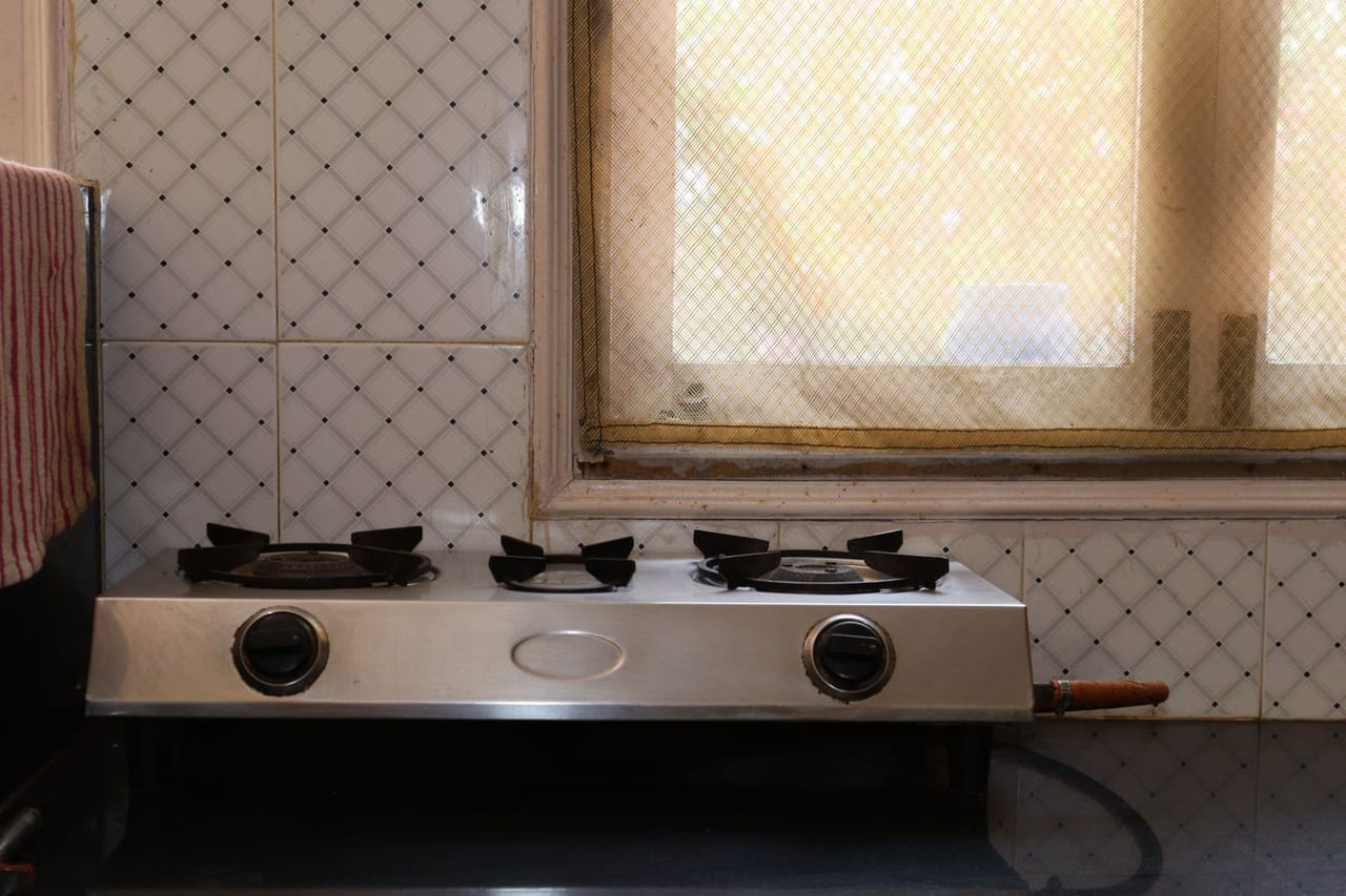 Appliance repair Lawton OK: Stainless steel kitchen stove near tiled wall