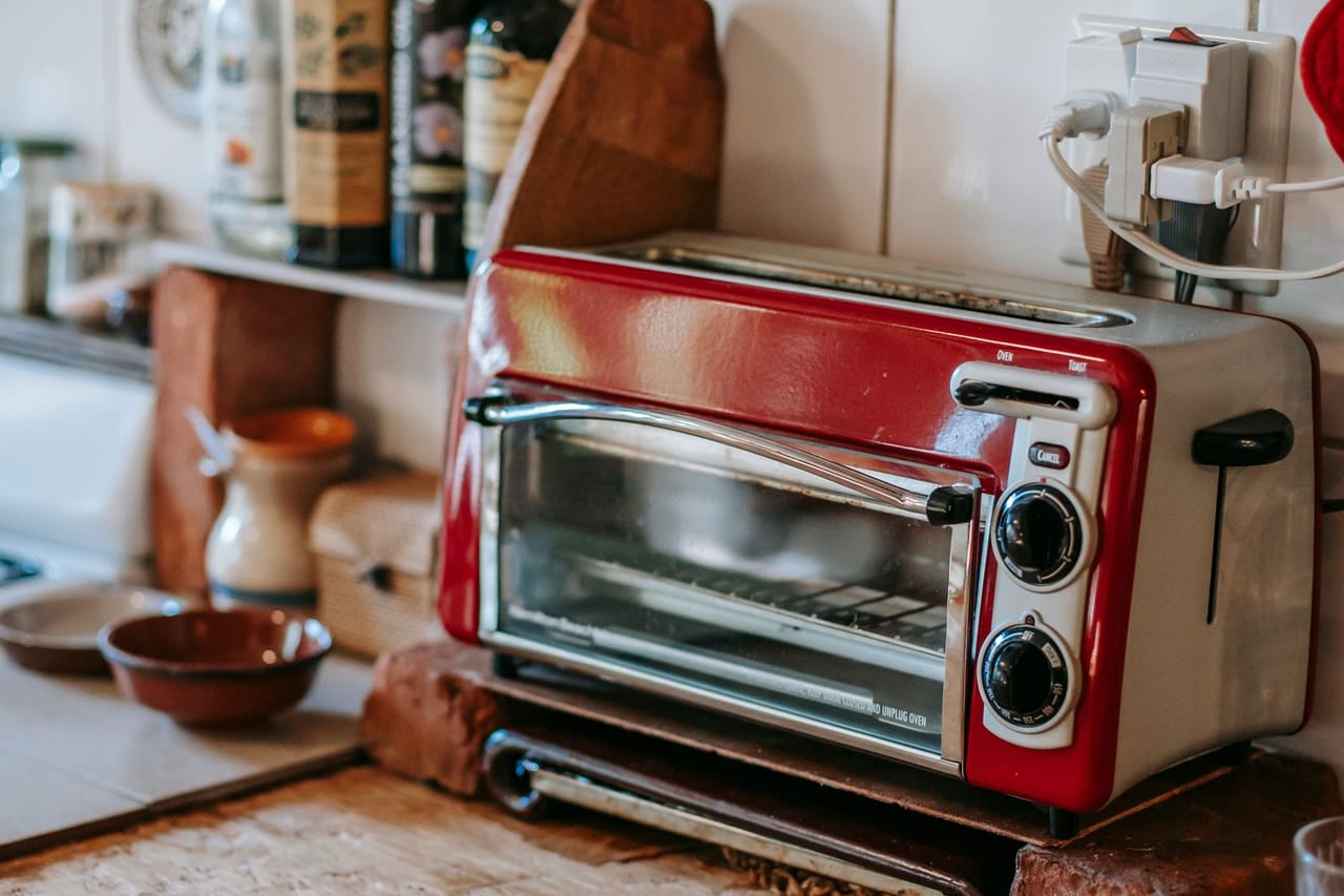 Appliance repair Mesa AZ: Toaster oven on table in kitchen