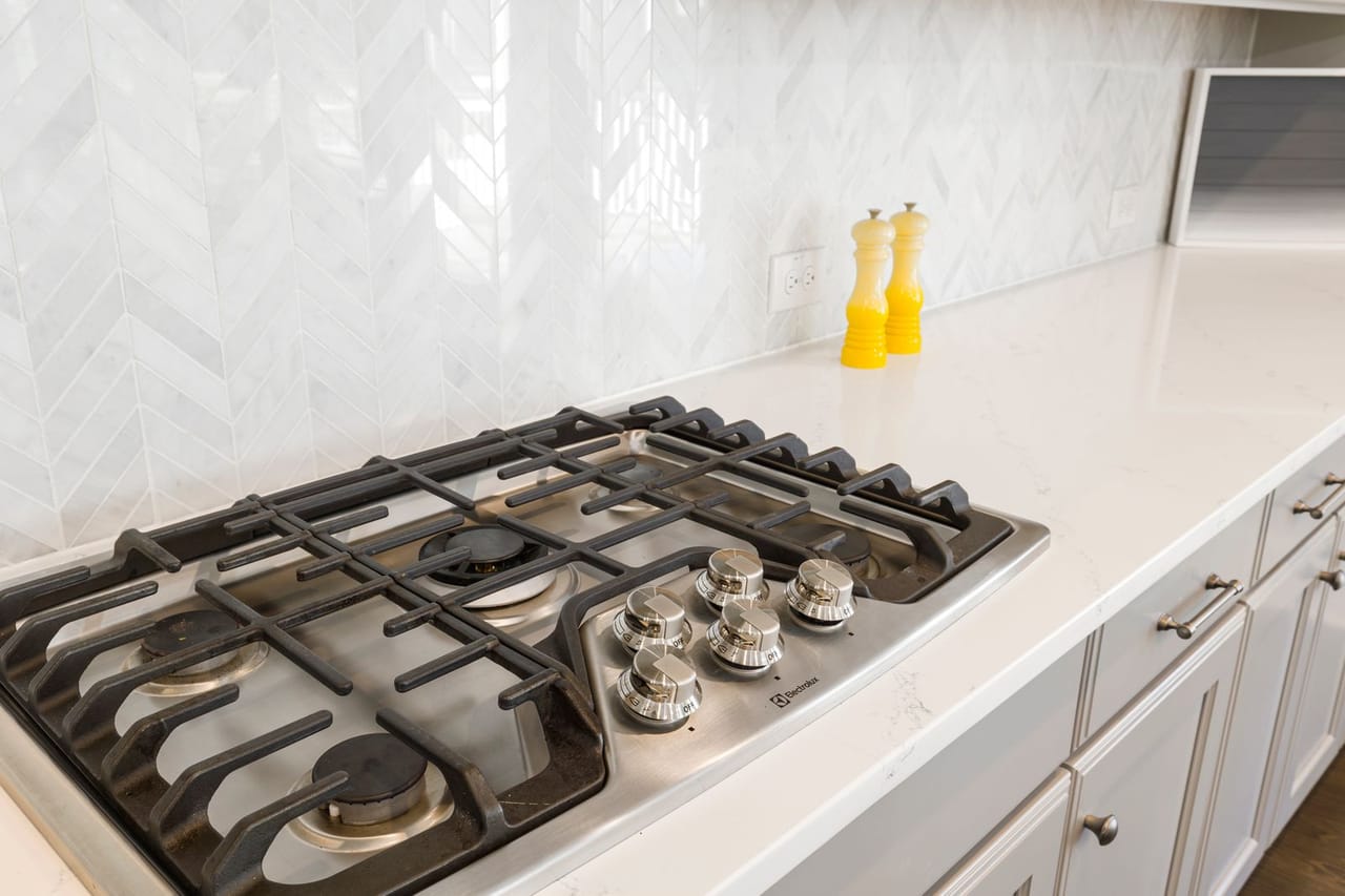 Appliance repair Morganton NC: Black and silver stove on white counter top