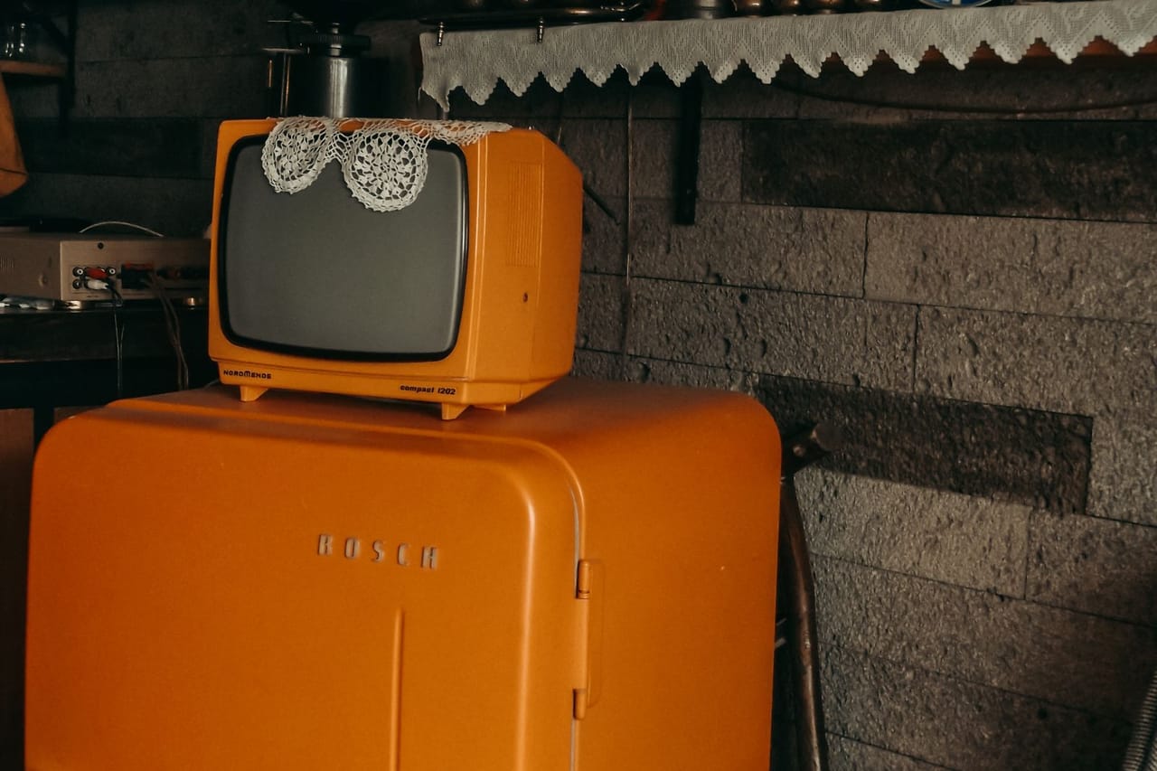 Appliance repair Muskegon MI: A television on top of a refrigerator