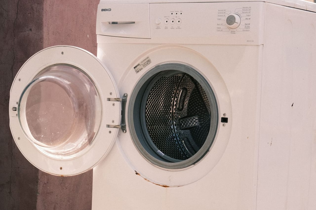 Appliance repair Napa CA: Stacked laundry machines with open door outdoors
