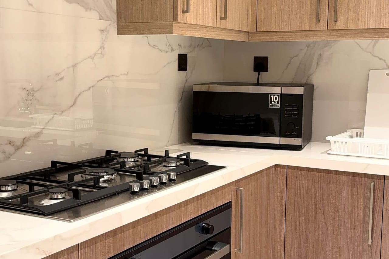 Appliance repair Norwood OH: Modern kitchen with gas stove and microwave