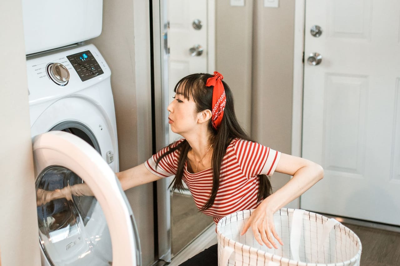 Appliance repair Palm Springs CA: A woman doing laundry
