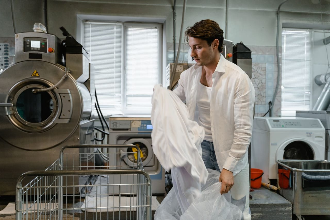 Appliance repair Palo Alto CA: Man in white long sleeves holding white cloth