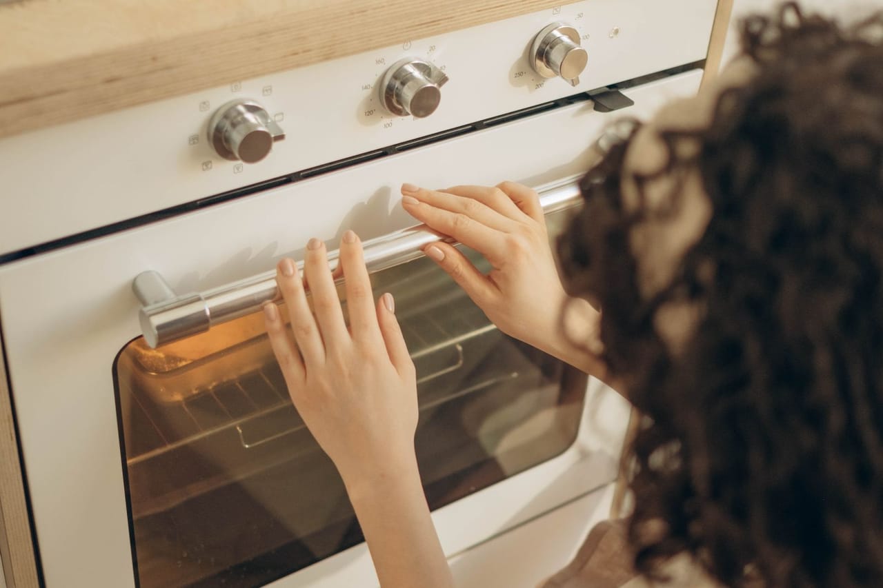 Appliance repair Pampa TX: A woman baking on a gas range oven