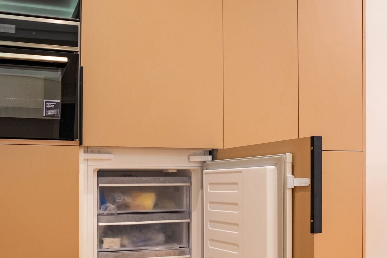 Appliance repair Pensacola FL: Modern kitchen with open integrated freezer