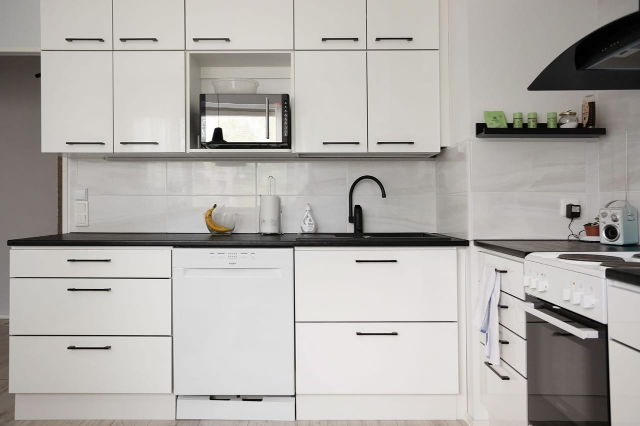 Appliance repair Plano TX: White closets in kitchen