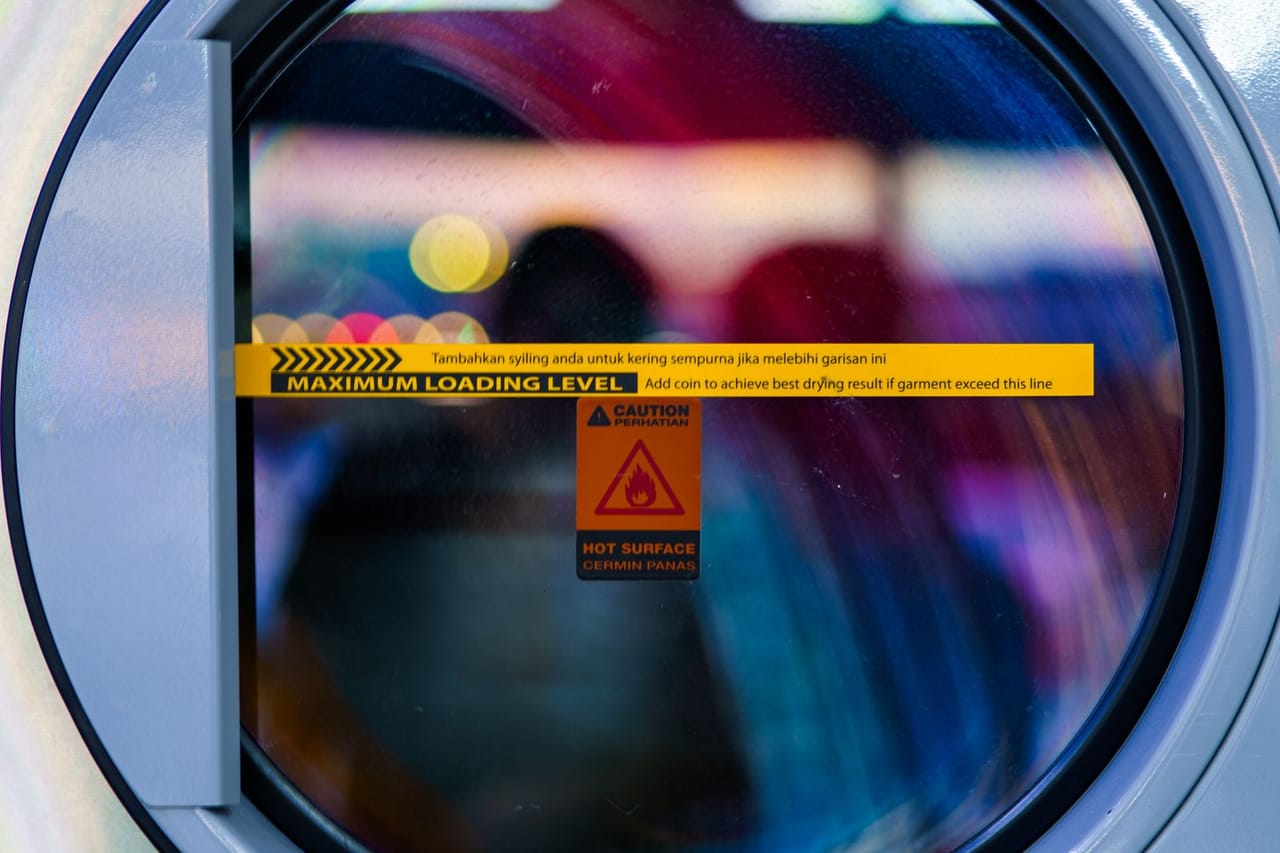 Appliance repair Rockville MD: Close up view of a vibrant washing machine door