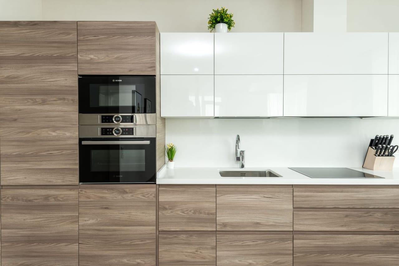 Appliance repair Saginaw MI: Wall of kitchen with modern furniture and appliances