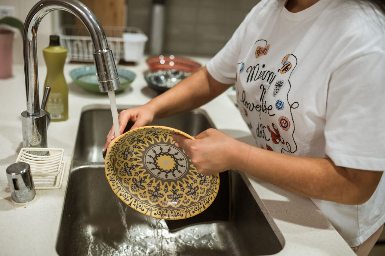 Appliance repair San Francisco CA: A woman washing a bowl