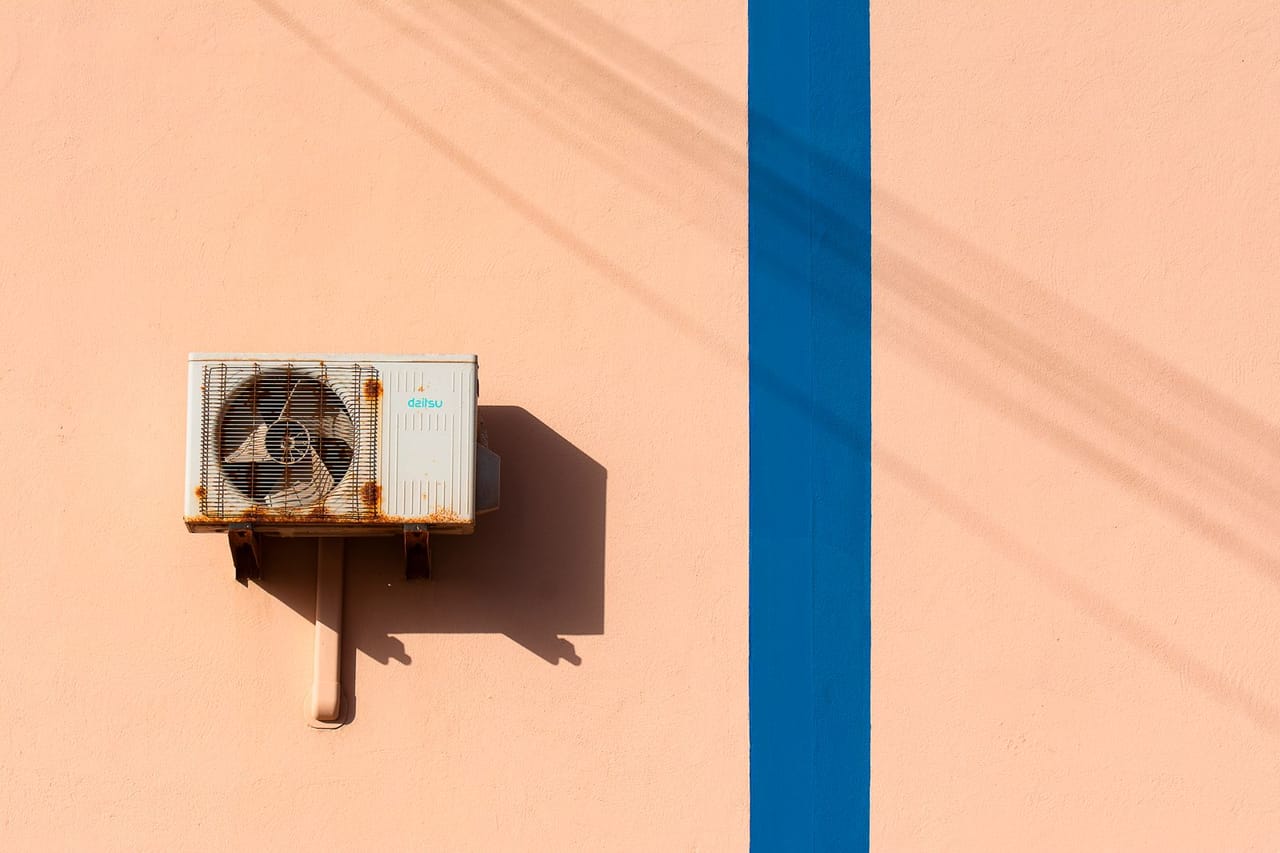 Appliance repair Santa Rosa CA: An air conditioner on a wall with blue lines