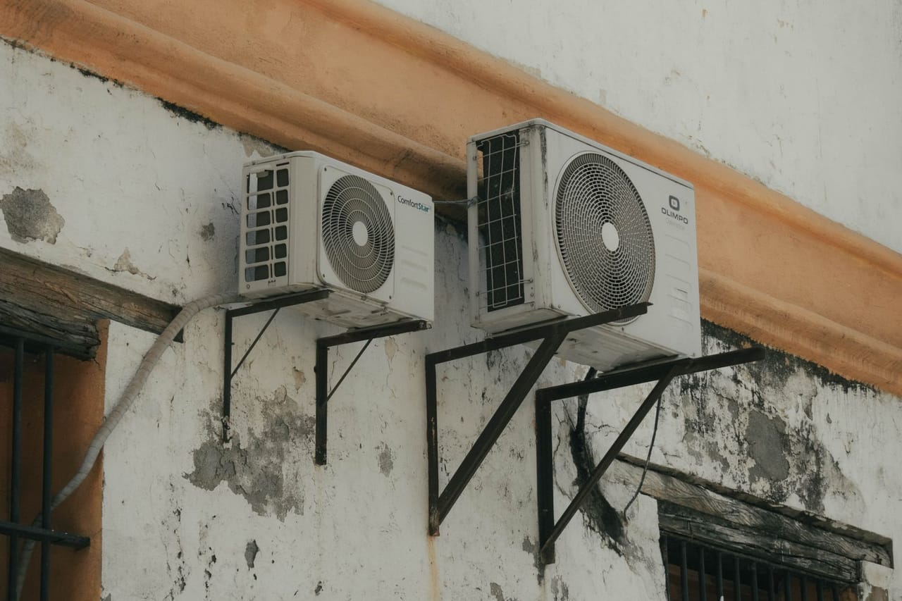 Appliance repair Sarasota FL: Aircon compressor on the wall
