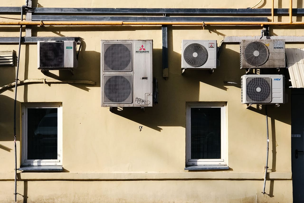 Appliance repair Scottsdale AZ: A concrete building with outer units of split type aircons mounted on wall