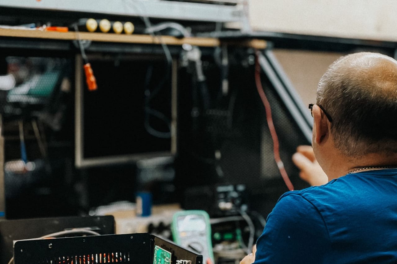 Appliance repair Somerset NJ: Man working on electronic repairs in workshop