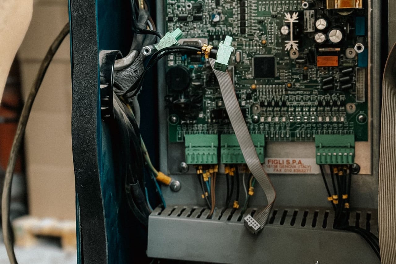 Appliance repair Springfield MA: Technician repairing circuit board in workshop