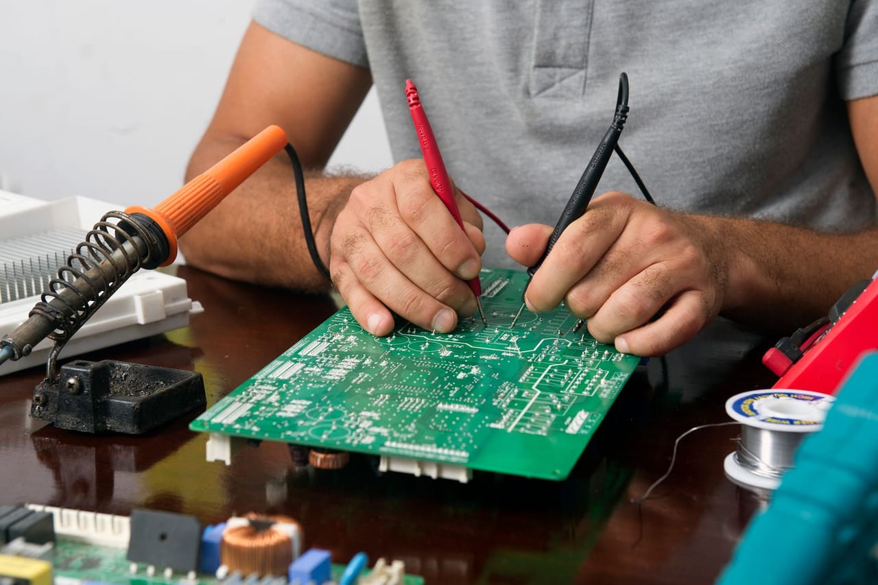 Appliance repair Springfield MO: Technician repairing an electronic device