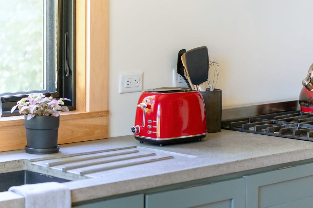 Appliance repair Virginia Beach VA: Modern kitchen countertop with red toaster