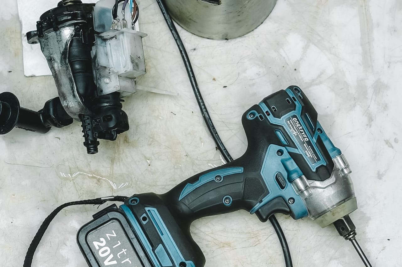 Cost of washer repair: Diy repair tools and disassembled appliance flat lay