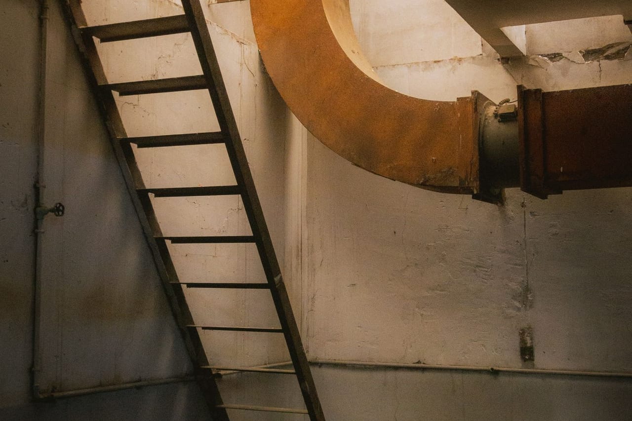 Dehumidifier for wet basement: Ladder in empty basement