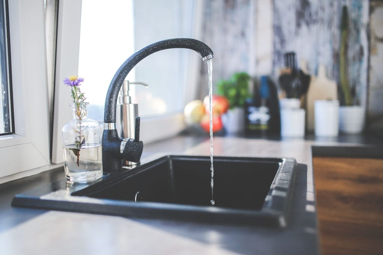 Dishwasher water backing up into sink: Water flows from the tap to sink