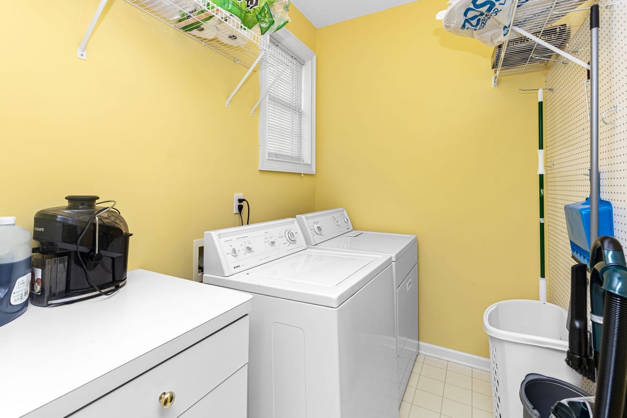 Dryer making loud noise: Bright laundry room with washer and dryer