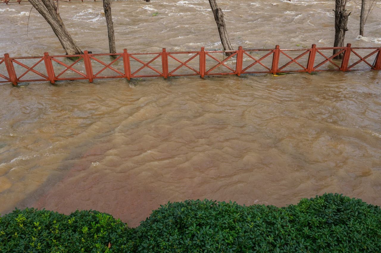 How to clean a flooded basement: Flooded urban area with overflowing river