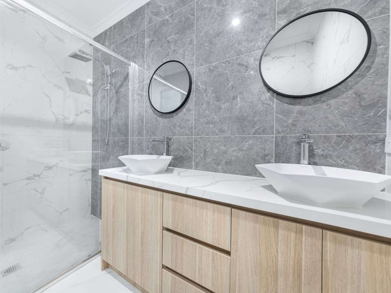 How to get rid of drain flies: bathroom vanity with a white vessel sink