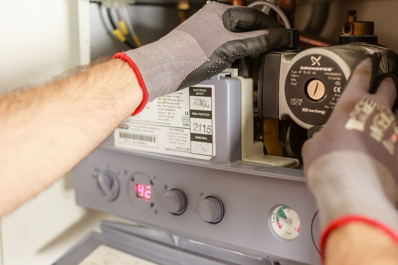 How to reset a garbage disposal: Plumber repairing power source
