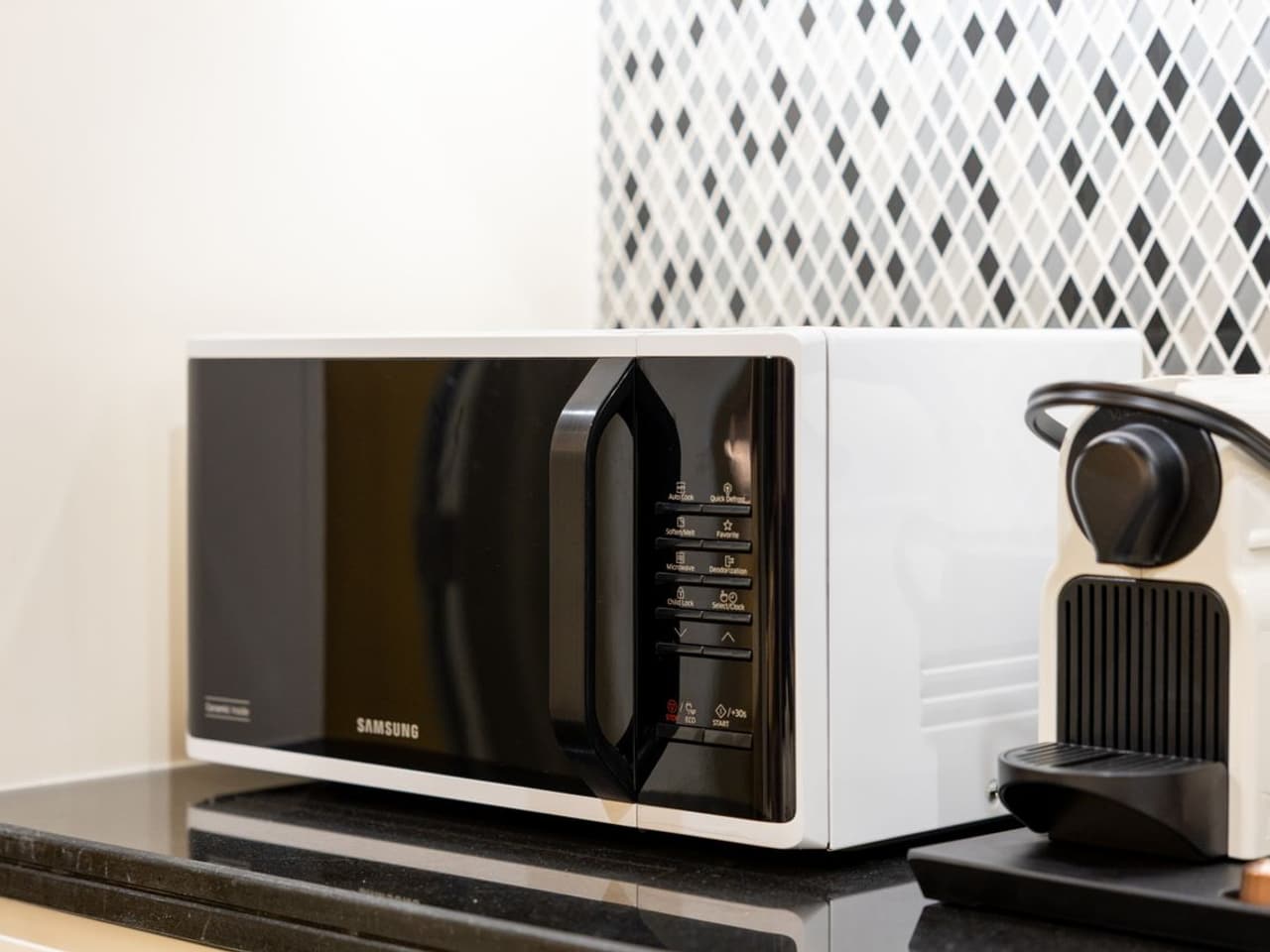 Microwave turntable not turning: black microwave on a kitchen counter