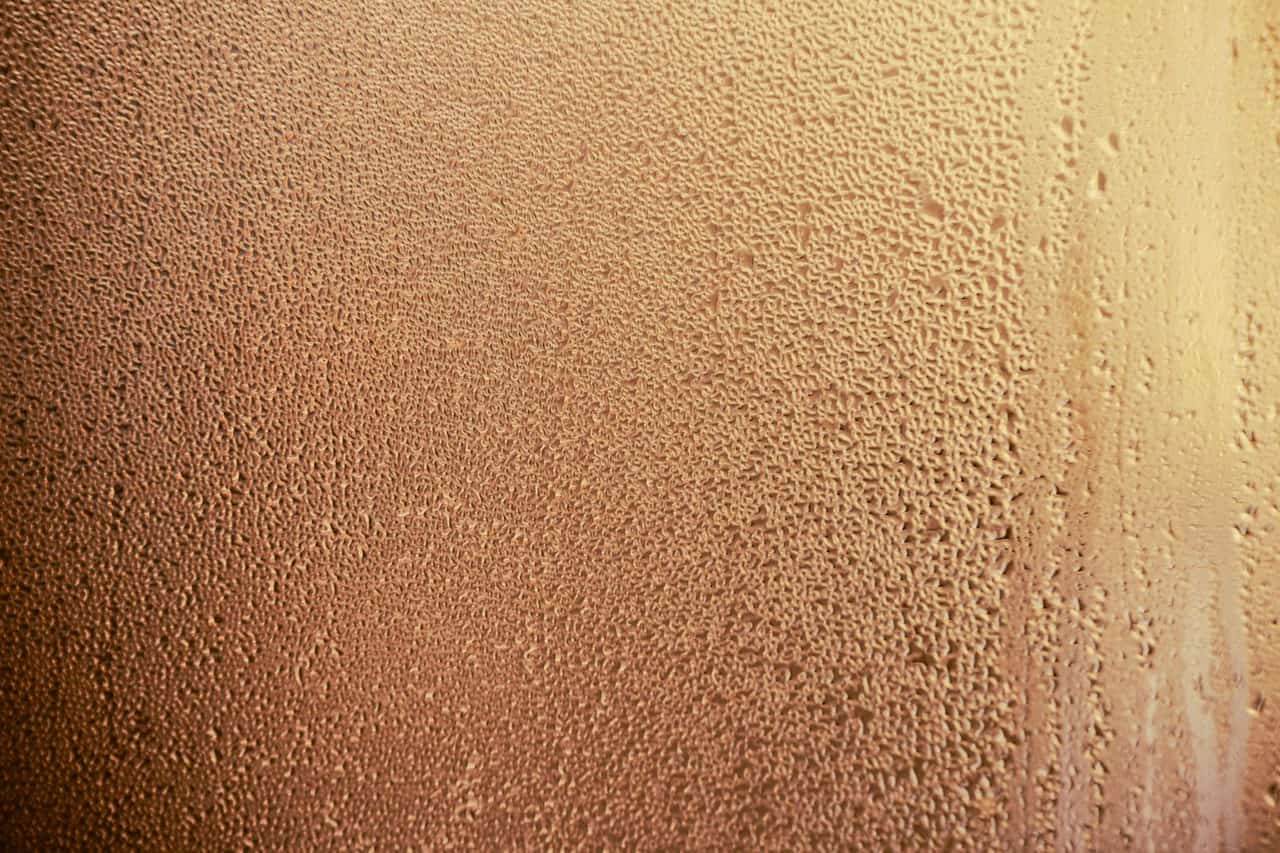 Moisture meter for walls: Close up photo of moisture on glass