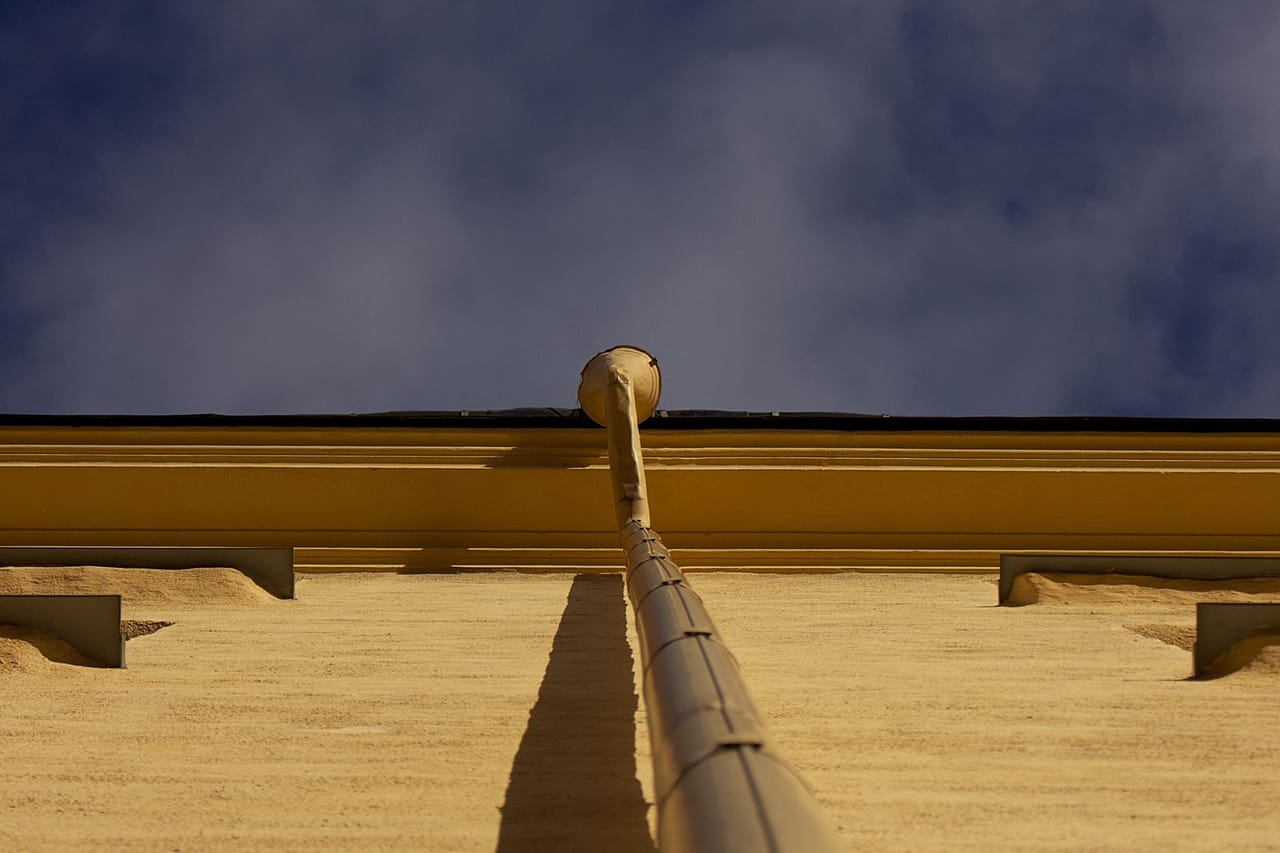 Plumber cost to unclog drain: Low angle view of drain pipe