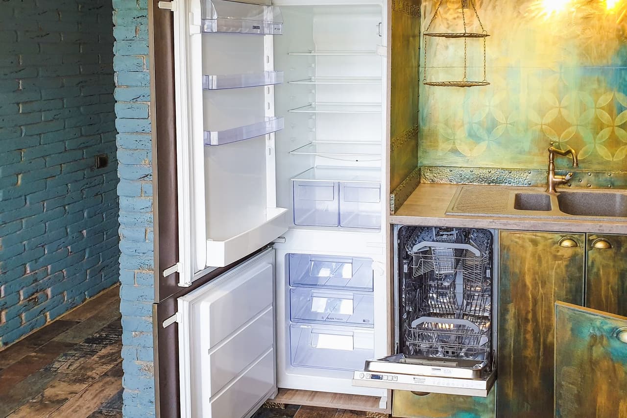 Refrigerator compressor repair cost: White refrigerator in the kitchen