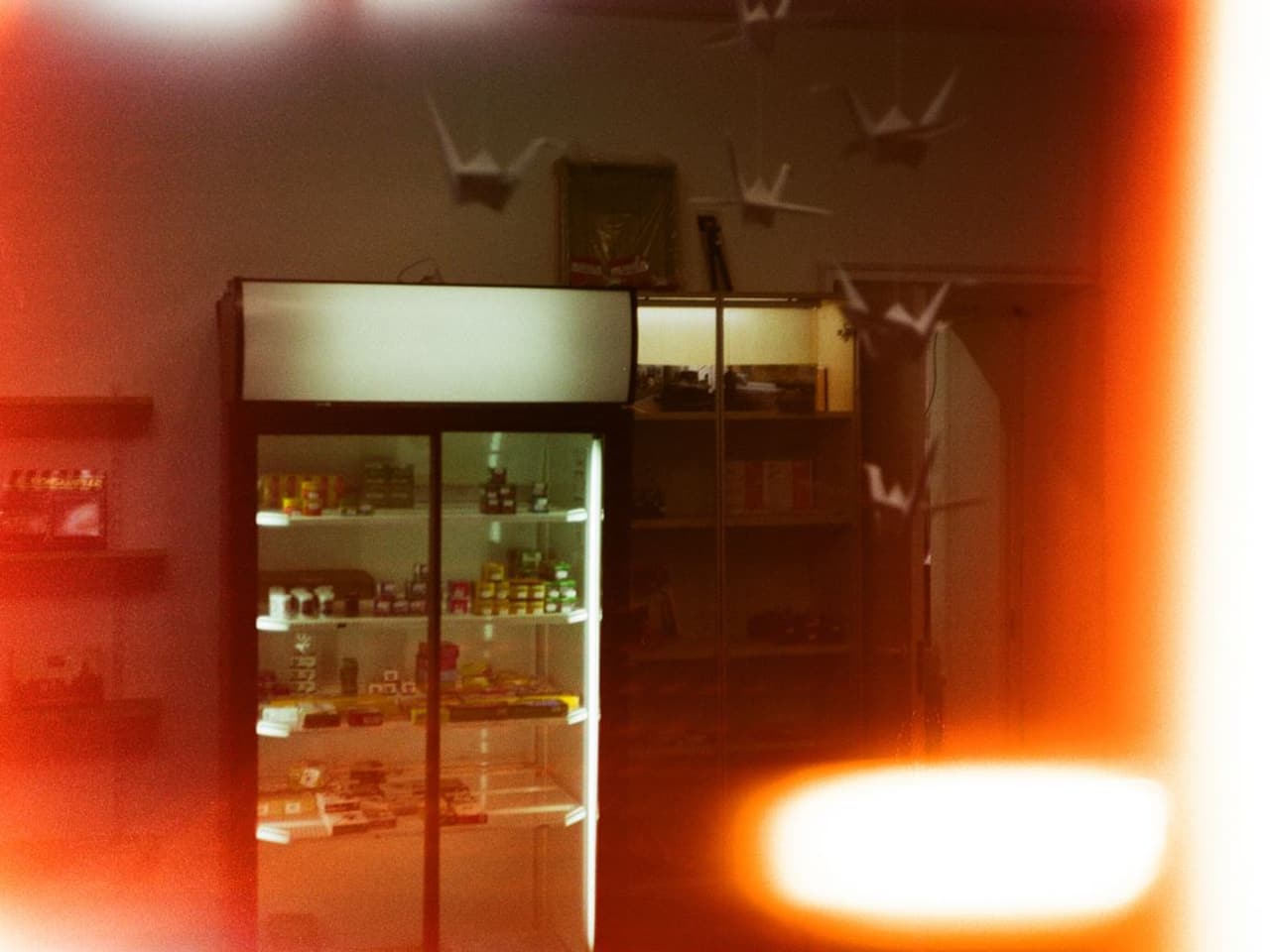 Refrigerator maintenance: refrigerator with an orange-lit interior