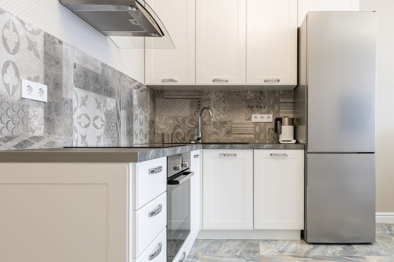 Refrigerator making loud noise: Contemporary kitchen interior with refrigerator and cupboards