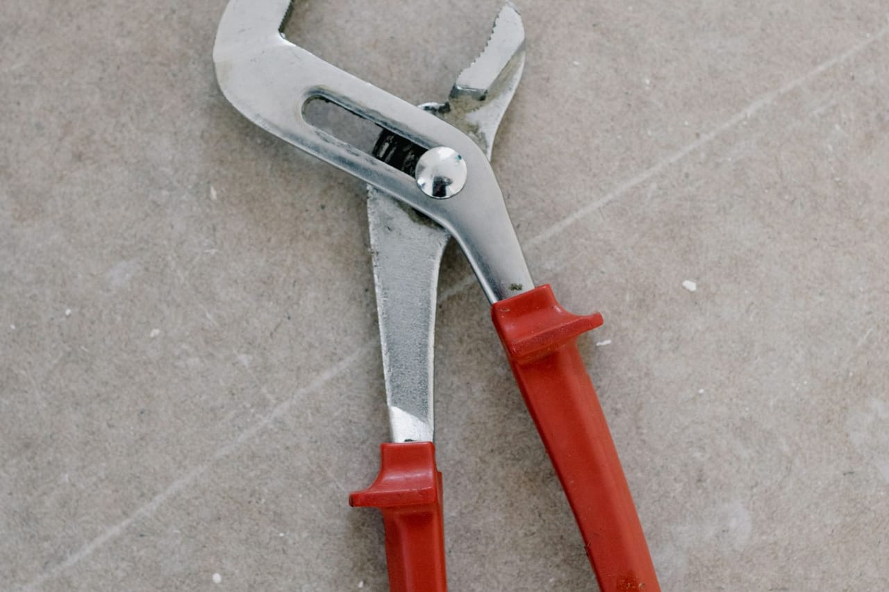 Slab leak repair: Pliers for repair on stone floor