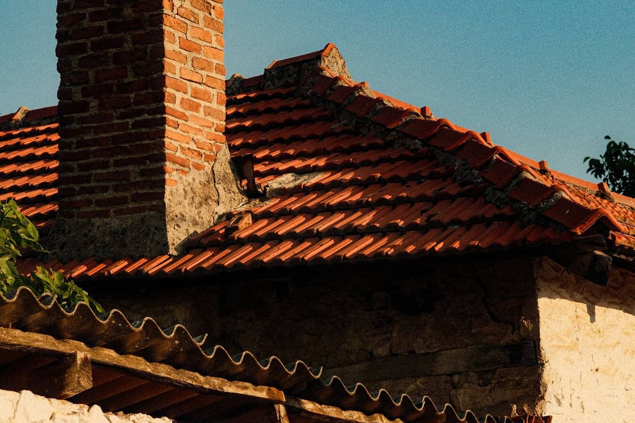 Soft spots on roof: Charming rustic rooftop with brick chimney