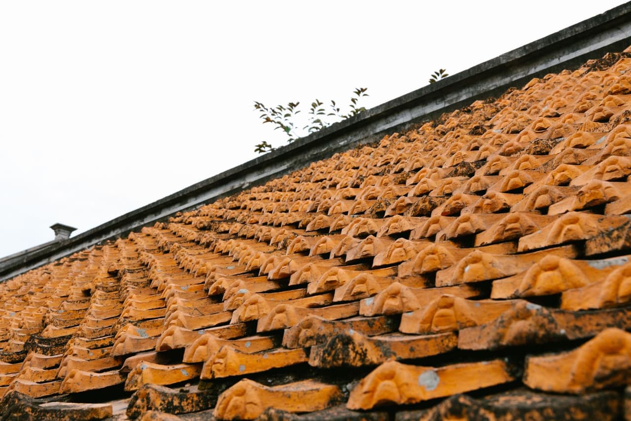 Typical roof replacement cost: Traditional orange tiled roof pattern