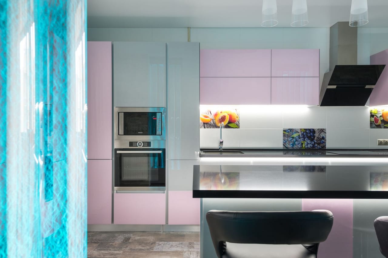 Washing machine shaking violently: Interior of modern kitchen with contemporary appliances
