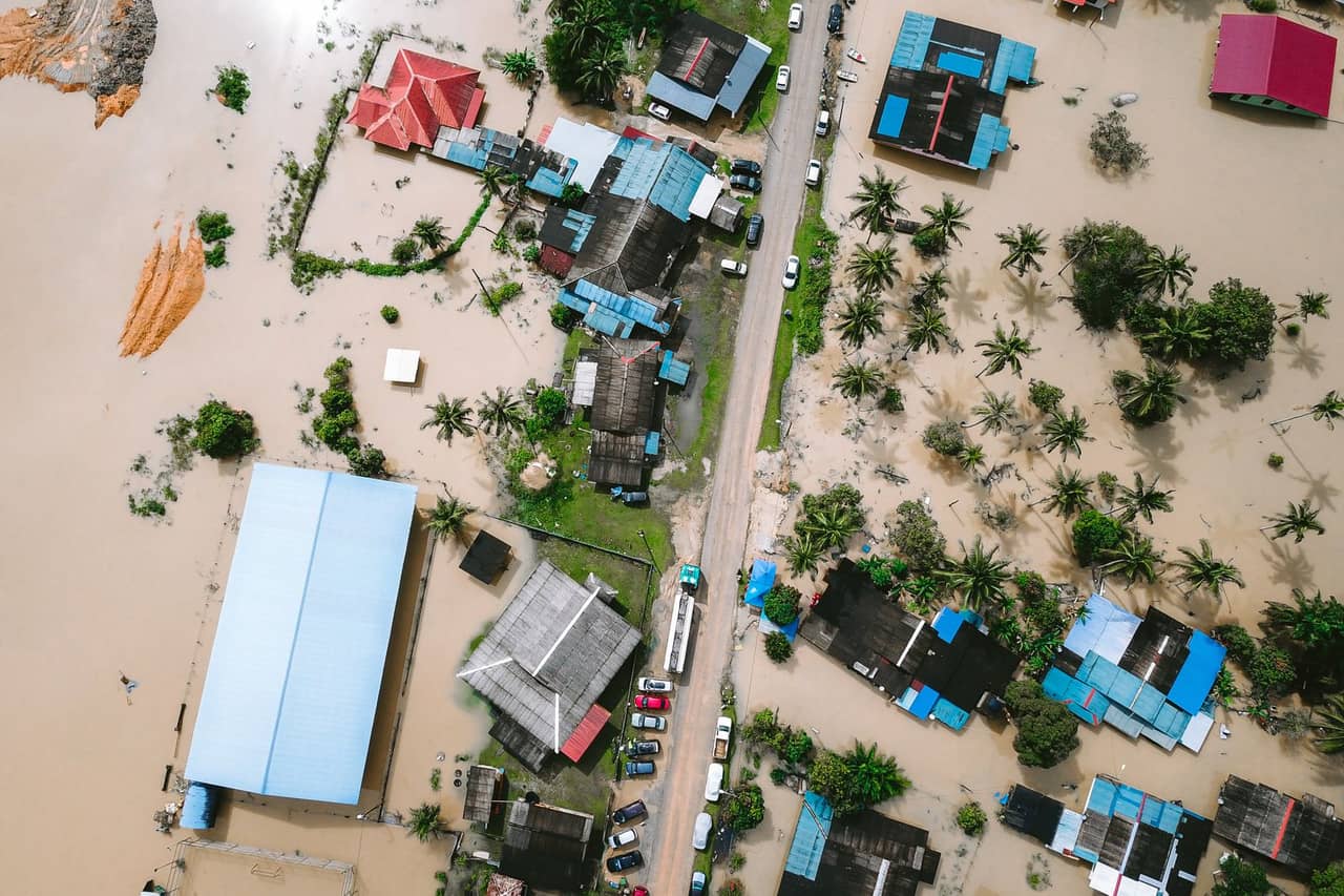 Water damage restoration cost: Buildings covered with the water