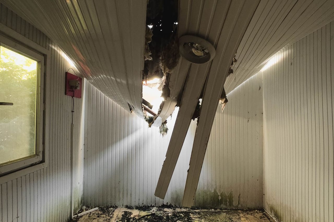 Water damaged drywall: Damaged room interior with collapsed ceiling