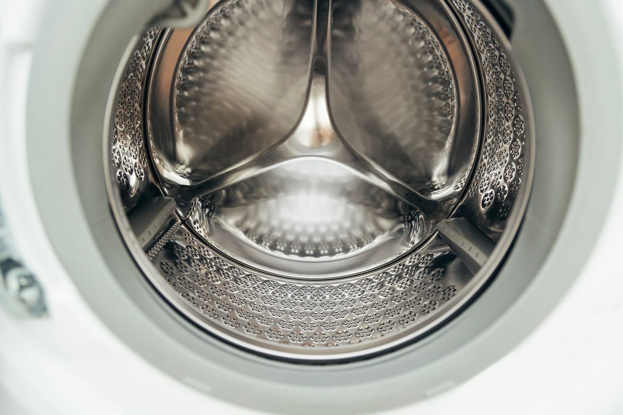Why my washing machine is not draining: Close up of stainless steel washing machine drum