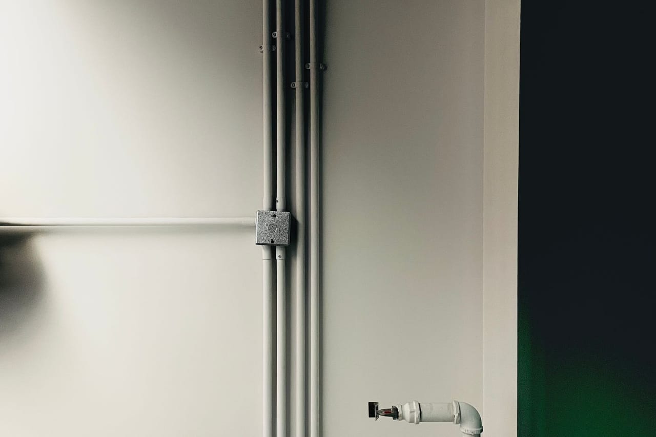 Plumber Bloomington MN: Pipes on white wall