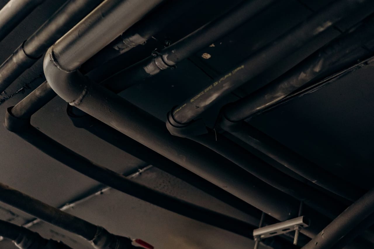 Plumber Bozeman MT: Pipes in dark place