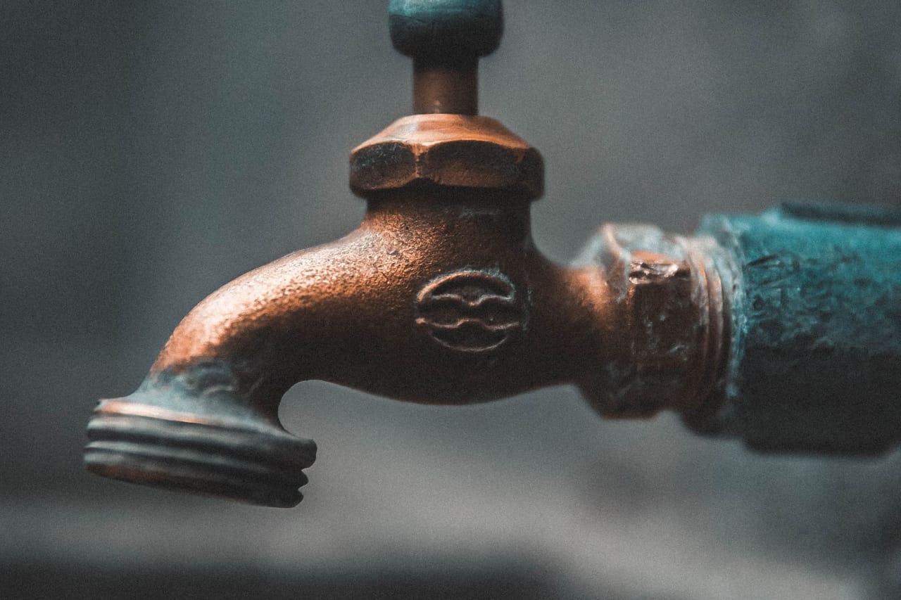 Plumber Davis CA: Close up shot of a metal faucet