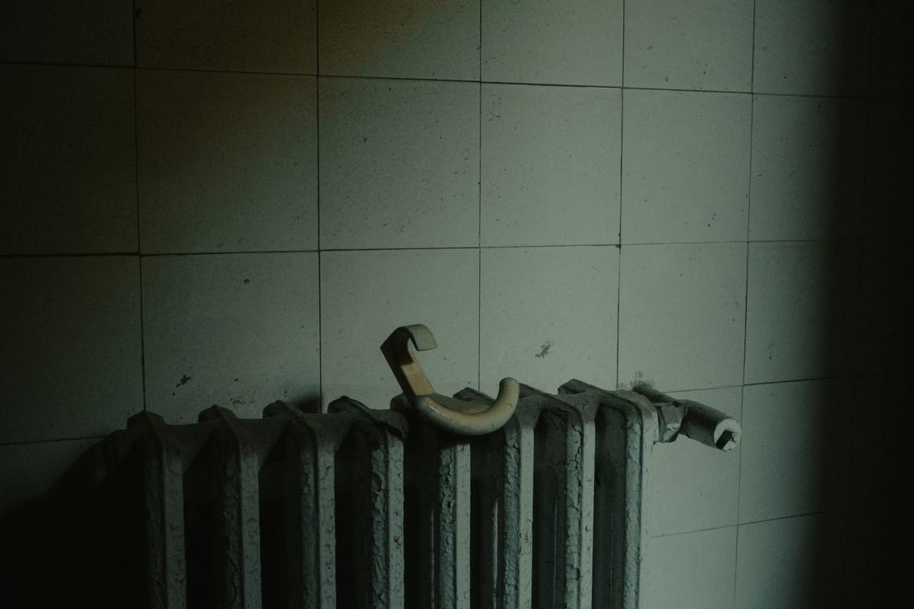 Plumber Fresno CA: Radiator on wall