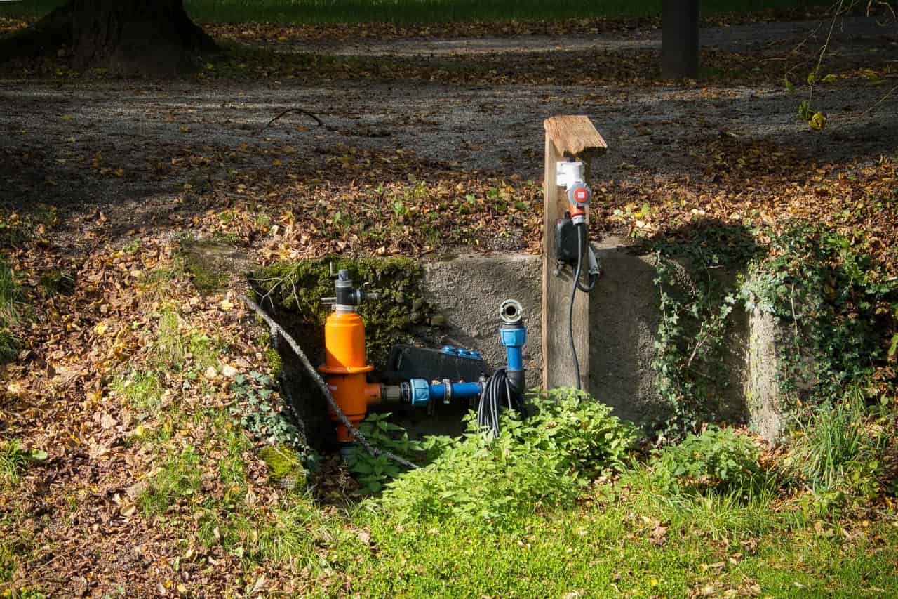 Plumber Mesa AZ: Outdoor water pipe installation in park setting